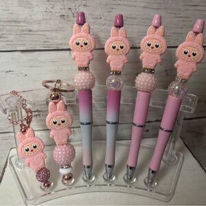 Labubu pens, keychains, and Stanley charms